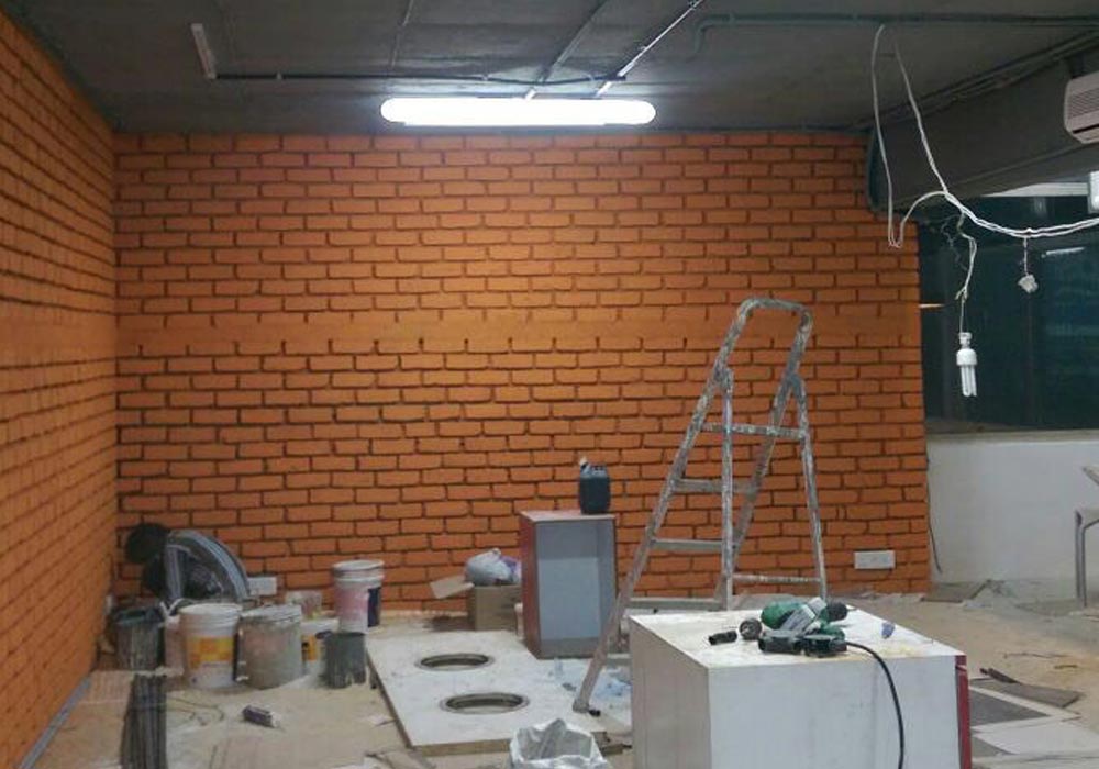 The brick wall just about complete.