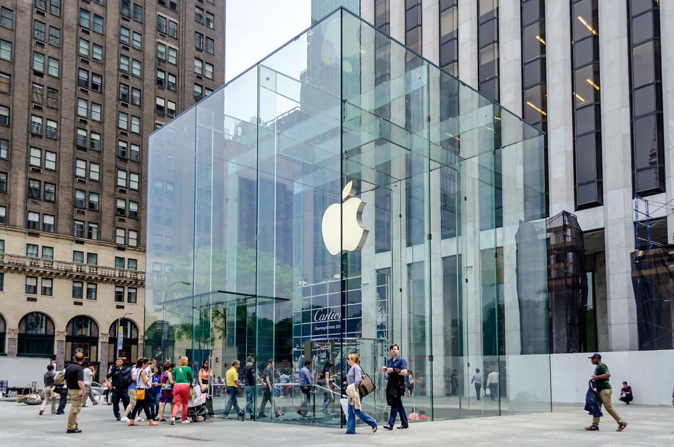 The famous Apple Store cube stands among designer brands on New York's posh 5th Avenue